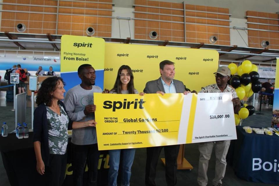 Spirit Airlines donated $20,000 to local charity Global Gardens as part of its launch of service at the Boise Airport, on Friday, Aug. 5, 2022. From left: Tina Wolfson, director of the Idaho Office for Refugees; Oliver Nsabimana and Karyn Levin, staffers with Global Gardens; John Kirby, Spirit’s vice president of network planning; and Rabiou Manzo, program manager of Global Gardens.