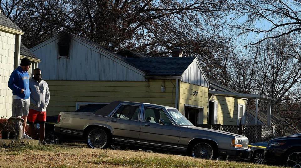 Two people died and a firefighter was injured when a fire swept through a home (rear) in Kansas City’s Northland early Friday, a fire department spokesman said. A neighbor called 911 shortly after 5:30 a.m. saying smoke was coming from a house on Northeast 45th Street near North Agness Avenue in Kansas City, North, said Fire Inspector Jason Spreitzer, a spokesman for the Kansas City Fire Department. As the investigation continued, two men watched from the house next door.