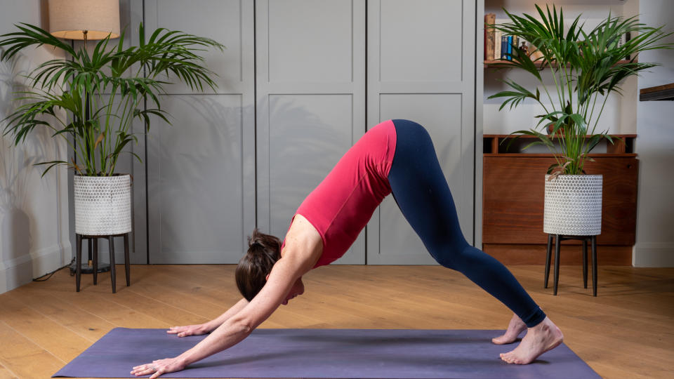 Woman performing a downward dog yoga stretch