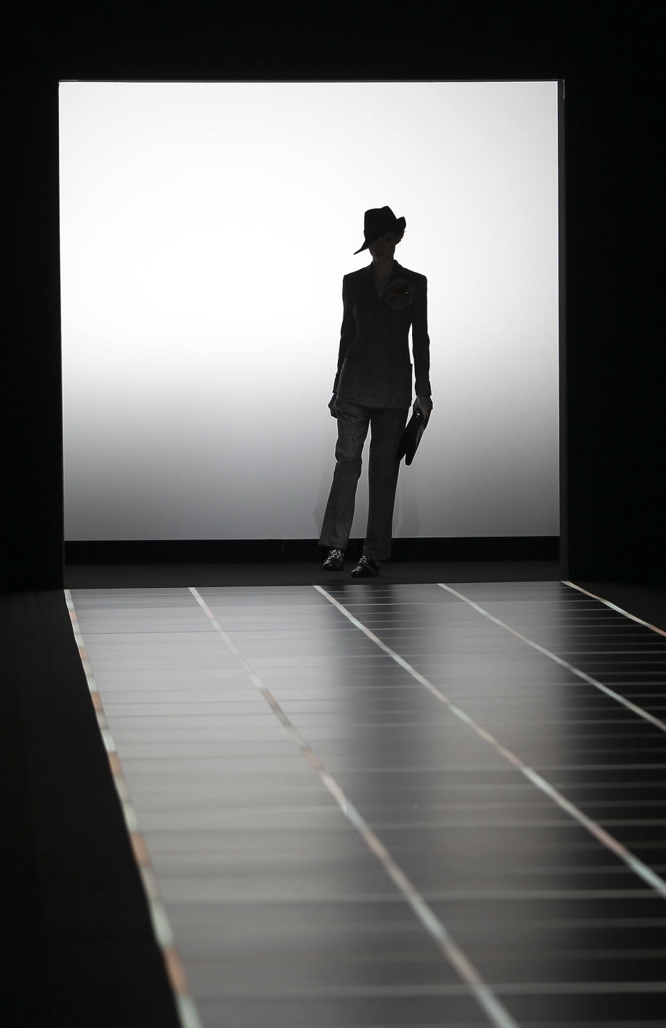 A model wears a creation part of the Giorgio Armani Women's Fall-Winter 2012-13 fashion collection, during the fashion week in Milan, Italy, Monday, Feb. 27, 2012. (AP Photo/Antonio Calanni)