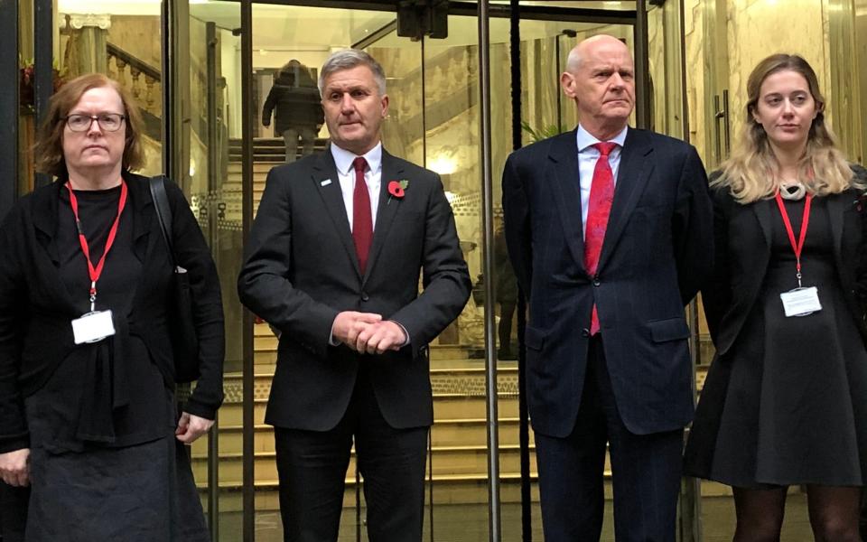 Richard Freeman, second left, with his defence team at the tribunal before its adjournment last November  - PA