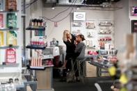 A woman has her make-up applied in a new beauty store "...le drugstore parisien" by French supermarket retailer Casino and beauty products group L'Oreal in Paris, France, June 22, 2018. REUTERS/Benoit Tessier