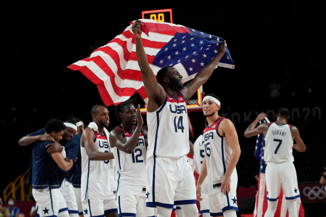 United States' basketball players celebrate after their win against France in men's basketball at the 2020 Summer Olympics, on Saturday, Aug. 7, 2021, in Saitama, Japan. (AP Photo/Eric Gay)