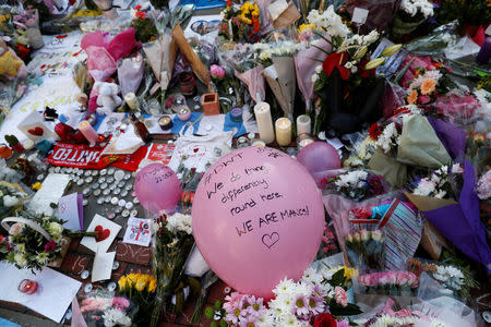 Flowers and messages of condolence are left for the victims of the Manchester Arena attack, in central Manchester, Britain May 25, 2017. REUTERS/Stefan Wermuth