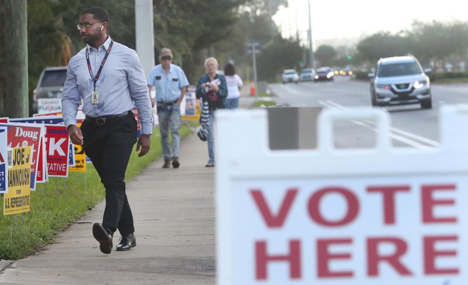 Voters walk to cast their votes at the Church of Christ on Beville Road ,Tuesday Morning November 8, 2022 as the midterm elections get underway.