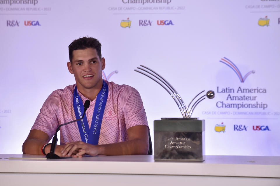 In this photo provided by the Latin America Amateur Championship, Aaron Jarvis speaks to reporters after winning the Latin America Amateur Championship on Jan. 23, 2022, in La Romana, Dominican Republic. The victory means Jarvis will be the first player from the Cayman Islands to play in the Masters in April. (Enrique Berardi/Latin America Amateur Championship via AP)