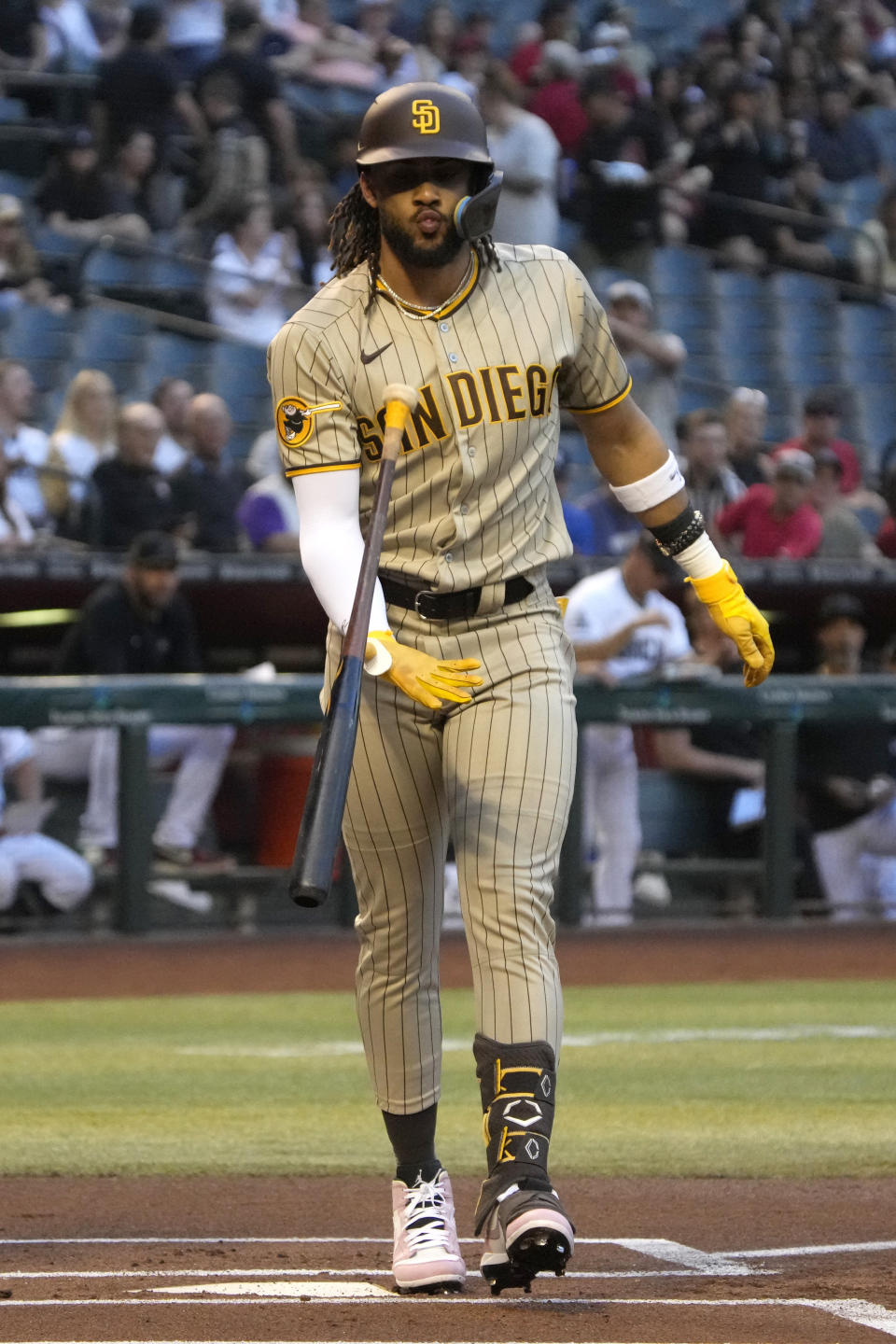 San Diego Padres' Fernando Tatis Jr. reacts after striking out during the first inning of the team's baseball game against the Arizona Diamondbacks, Thursday, April 20, 2023, in Phoenix. (AP Photo/Rick Scuteri)