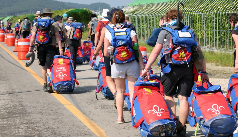 British scout members leave the World Scout Jamboree campsite in Buan, South Korea, on Aug. 6, 2023.