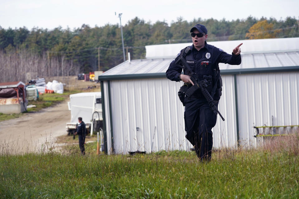 FILE - A police officer gives an order to the public Oct. 27, 2023, in Lisbon, Maine, as they search Robert Card, the suspect in a deadly mass shootings. Thousands of pages Maine State Police documents released Friday, June 7, 2023, include detailed descriptions of the chaos and carnage surrounding the state’s deadliest mass shooting. (AP Photo/Robert F. Bukaty, File)