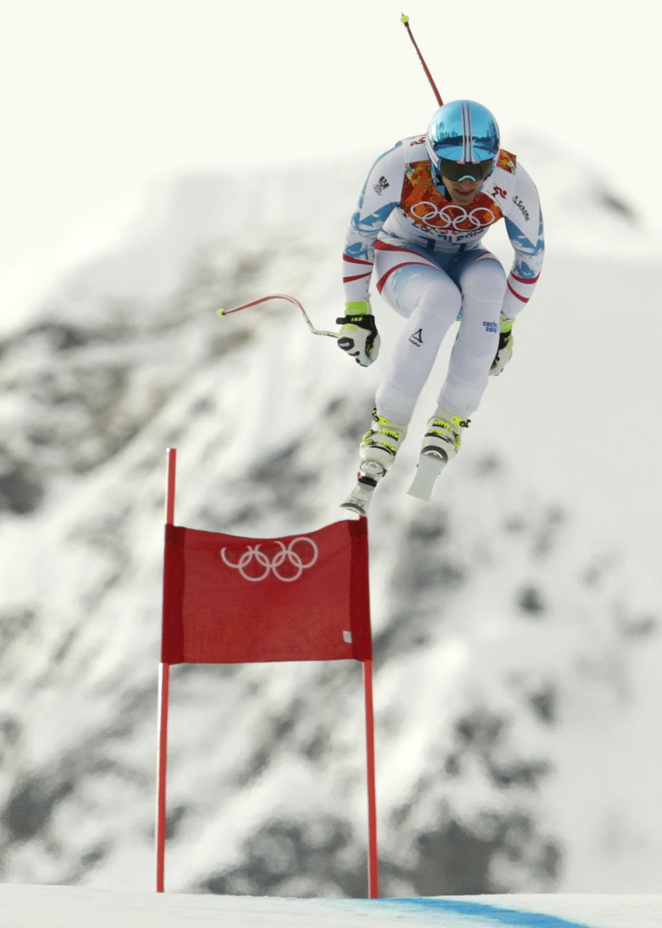 Austria's Matthias Mayer jumps during the men's downhill at the Sochi 2014 Winter Olympics, Sunday, Feb. 9, 2014, in Krasnaya Polyana, Russia.(AP Photo/Charles Krupa)