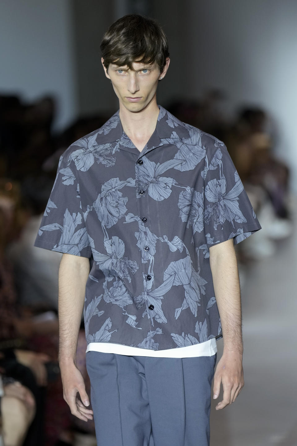 A model wears a creation as part of the Neil Barret men's Spring Summer 2024 collection presented in Milan, Italy, Saturday, June 17, 2023. (AP Photo/Antonio Calanni)