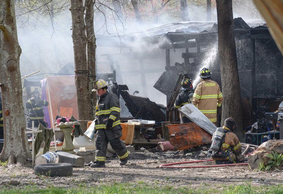 Chief Greg Elgin, left, walks near the house fire at the 800 block of Brazeale Street in Belton Tuesday, March 26, 2019. The man, woman, and dog at the home were unharmed at the fire which Cheddar fire responded to, with assist from Belton, Rock Springs and Belton EMS. Anderson County fire investigator Wendall Marshall was at the scene of the fire under investigation. 