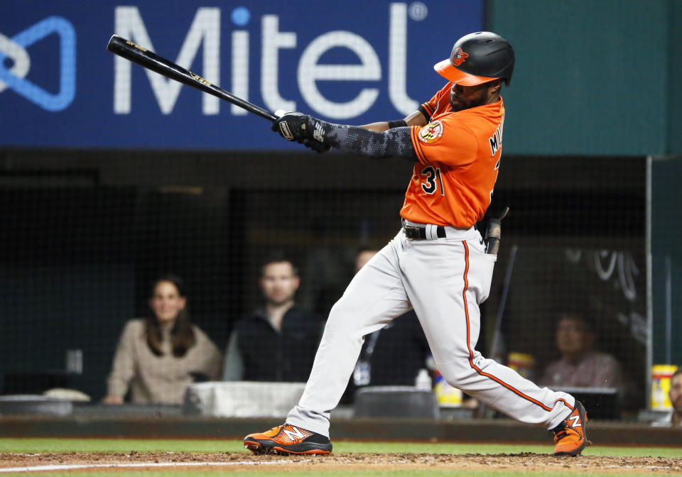Baltimore Orioles' Cedric Mullins follows thru on an RBI single against the Texas Rangers during the seventh inning of a baseball game in Arlington, Texas, Saturday, April 17, 2021. (AP Photo/Ray Carlin)