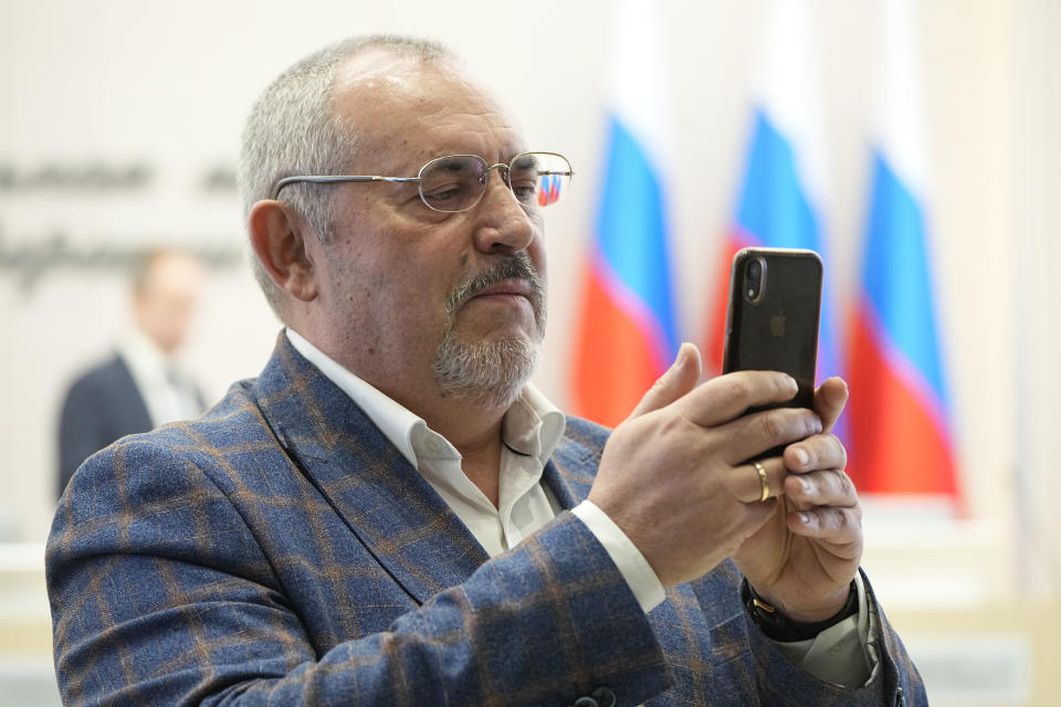 Boris Nadezhdin, a liberal Russian politician who is seeking to run in the March 17 presidential election, holds his phone waiting the beginning of the meeting of the Russia's Central Election Commission in Moscow, Russia, Thursday, Feb. 8, 2024. Russia's Central Election Commission holds a meeting where it decides whether an opposition presidential candidate Boris Nadezhdin is qualified to run in the March election. (AP Photo/Alexander Zemlianichenko)