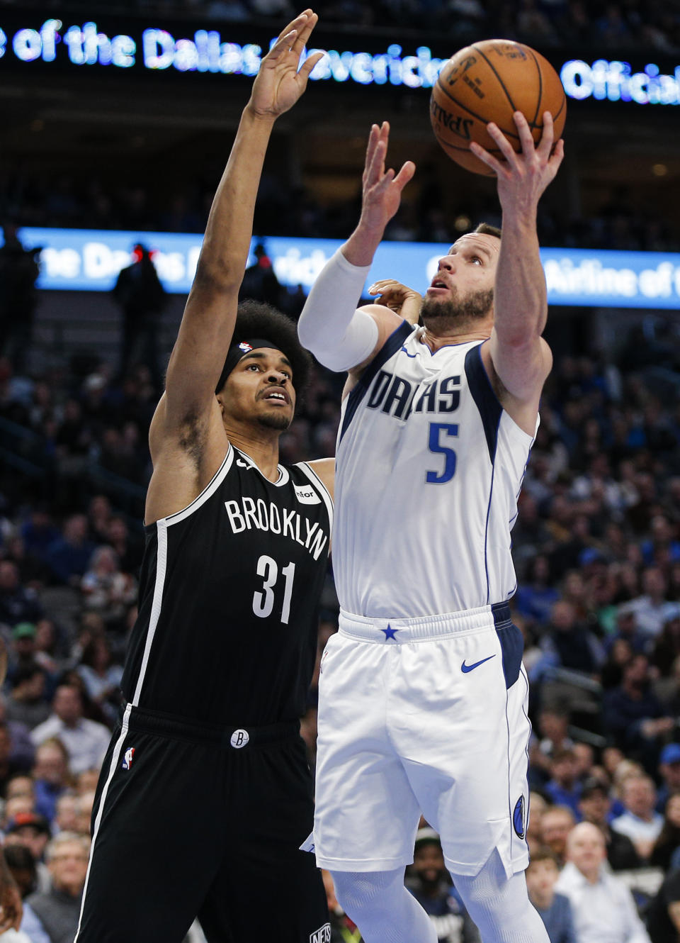 Dallas Mavericks guard J.J. Barea (5) attempts a layup as Brooklyn Nets forward Jarrett Allen (31) defends during the first half of an NBA basketball game Thursday, Jan. 2, 2020, in Dallas. (AP Photo/Brandon Wade)