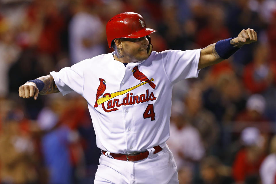 St. Louis Cardinals' catcher Yadier Molina celebrated Dexter Fowler's go-ahead home run before the pitch left the pitcher's hand. (AP Photo/Billy Hurst)