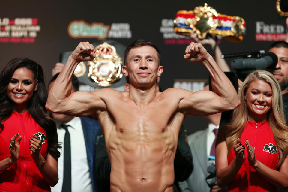WBC/WBA middleweight champion Gennady Golovkin of Kazakhstan flexes on stage during an official weigh-in at T-Mobile Arena in Las Vegas Friday, Sept. 14, 2018. Golovkin will defend his title against Canelo Alvarez, of Mexico, in a rematch at the arena on Saturday. (Steve Marcus/Las Vegas Sun via AP)