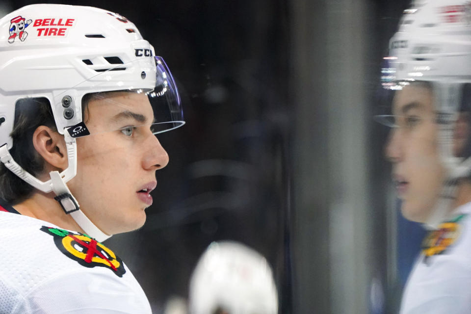 Chicago Blackhawks center Connor Bedard watches from the bench during the second period of the team's NHL hockey game against the New York Rangers in New York, Thursday, Jan. 4, 2024. (AP Photo/Peter K. Afriyie)