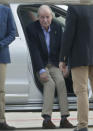 Spain's former King Juan Carlos gets into a car on arrival by private jet at the Peinador airport in Vigo, north western Spain, Thursday, May 19, 2022. Spain's former King has returned to Spain Thursday for his first visit since leaving nearly two years ago amid a cloud of financial scandals. (AP Photo/Lalo R. Villar)