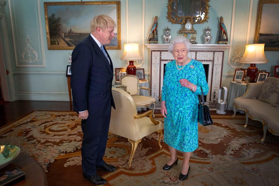 Britain's Queen Elizabeth II welcomes newly elected leader of the Conservative party, Boris Johnson during an audience in Buckingham Palace, London on July 24, 2019, where she invited him to become Prime Minister and form a new government. - Boris Johnson took over as Britain's prime minister Wednesday, promising to pull his country out of the European Union on October 31 by any means necessary. (Photo by Victoria Jones / POOL / AFP)        (Photo credit should read VICTORIA JONES/AFP via Getty Images)