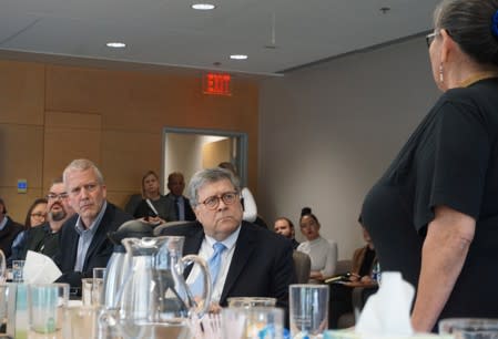 U.S. Attorney General William Barr and Senator Dan Sullivan looks on as Julie Roberts-Hyslop speaks during a Department of Justice roundtable with Alaska native leaders in Anchorage