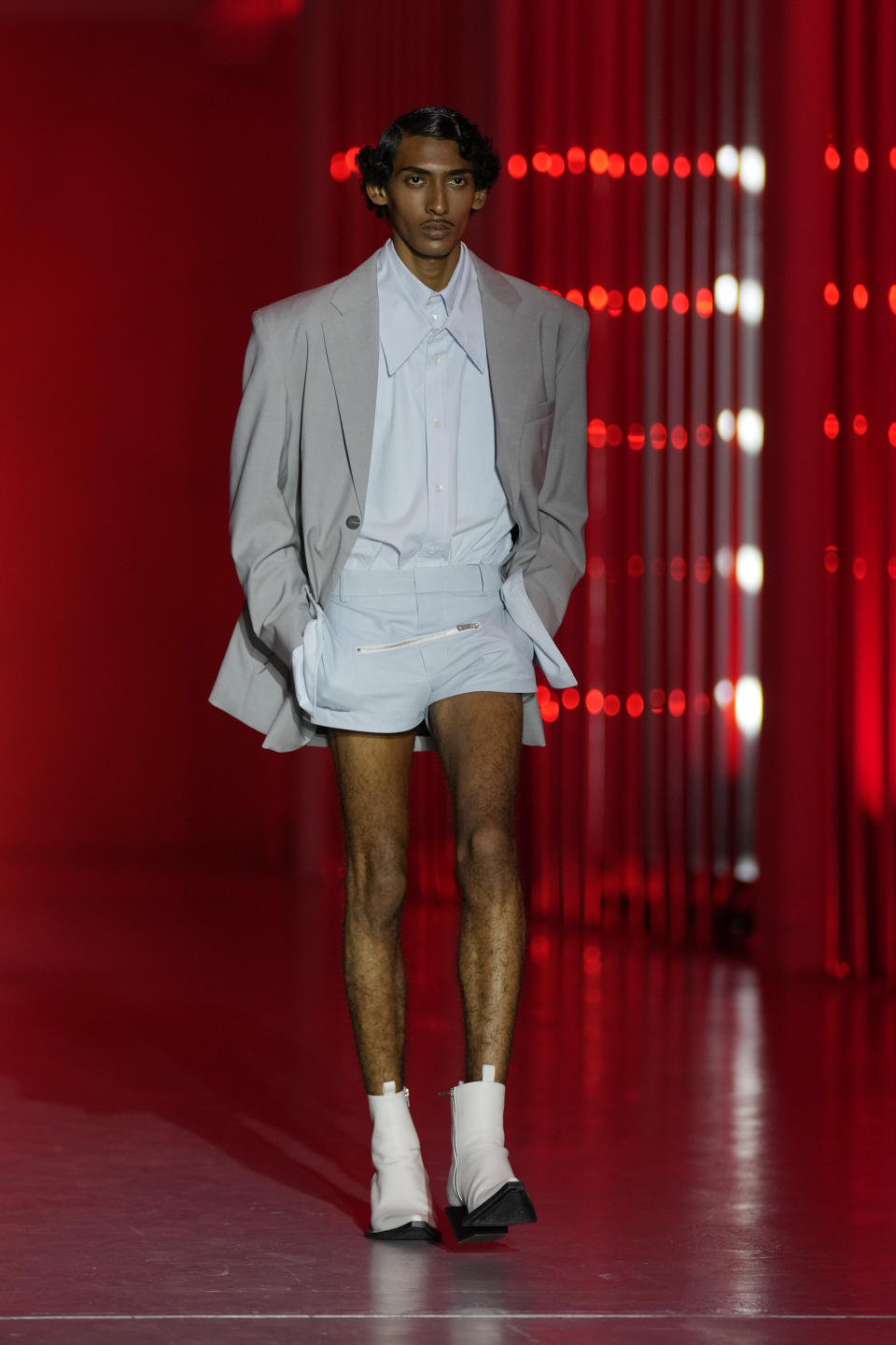 A model wears a creation as part of the Jordanluca men's and women's Spring Summer 2024 collection, unveiled during the Fashion Week in Milan, Italy, Saturday, June 17, 2023. (AP Photo/Antonio Calanni)