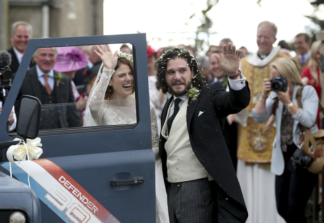 Kit Harington and Rose Leslie leave Rayne Church following their wedding ceremony. (Jane Barlow/PA via AP)