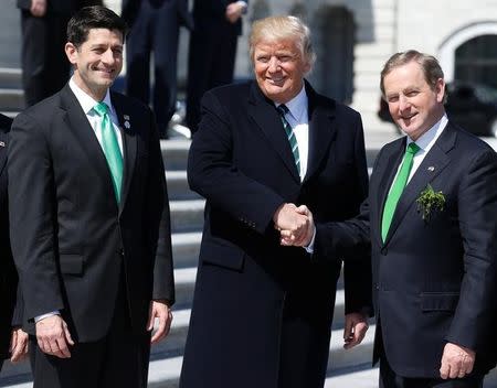 U.S. President Donald Trump shakes hands with Irish Taoiseach (Prime Minister) Enda Kenny as Speaker of the House Paul Ryan (R-WI) watches after attending a Friends of Ireland reception on Capitol Hill in Washington, U.S., March 16, 2017. REUTERS/Joshua Roberts