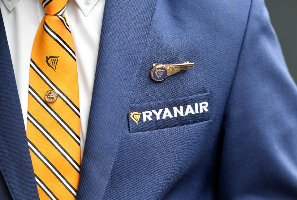 A Ryanair cabin crew member and union representative arrives ahead of a press conference held by Ryanair unions representatives, in Brussels, on September 13, 2018. - Ryanair cabin crew members from five European countries will go on strike on September 28, a Belgian union said on September 13, 2018. Staff from Belgium, the Netherlands, Italy, Spain and Portugal will stage a stoppage on the Irish no-frills airline, the CNE said, after several European labour unions met in Brussels. (Photo by Emmanuel DUNAND / AFP)        (Photo credit should read EMMANUEL DUNAND/AFP via Getty Images)