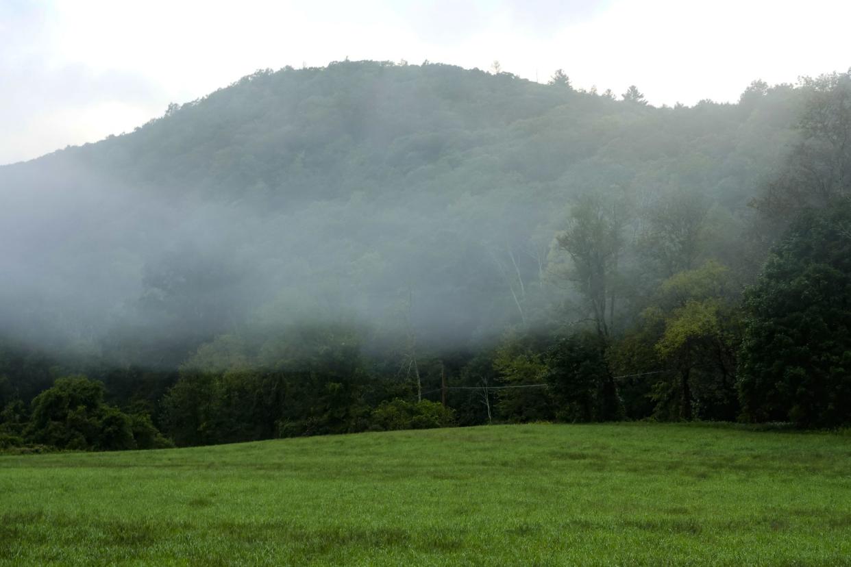 Canaan, Connecticut USA Early morning fog rolling over the hills.