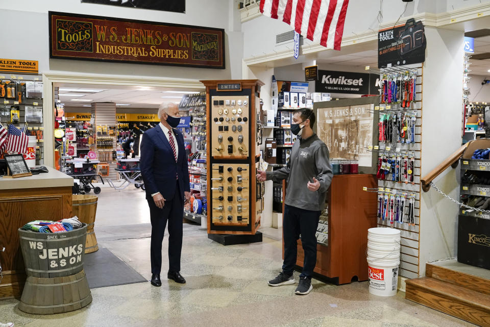 President Joe Biden speaks with Michael Siegel, Co-owner of W.S. Jenks & Son, right, as he visits W.S. Jenks & Son hardware store, a small business that received a Paycheck Protection Program loan, Tuesday, March 9, 2021, in Washington. (AP Photo/Patrick Semansky)