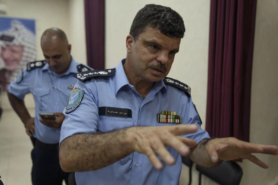 Jenin's police commander Brig. Gen. Azzam Jebara talks to the Associated Press following a ceremony to decorate Palestinian security officers, who responded to an arson attack by angry protesters on the Jaba police station in July, at the governorate headquarters of the occupied West Bank city of Jenin, Sunday, Aug. 13, 2023. (AP Photo/Nasser Nasser)