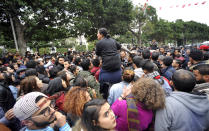 <p>People gather during a protest against the 2018 budget in Tunis, Jan. 9, 2018. (Photo: Hassene Dridi/AP) </p>