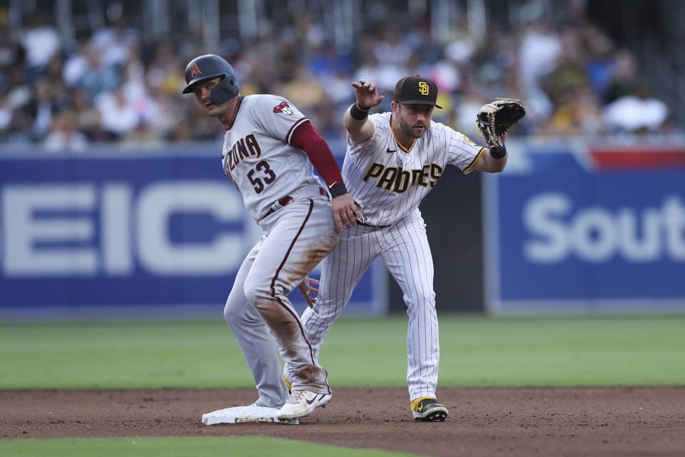 Arizona Diamondbacks' Christian Walker collides with San Diego Padres second baseman Matthew Batten after being forced out on a double play hit into by Jordan Luplow during the fifth inning of a baseball game Saturday, July 16, 2022, in San Diego. (AP Photo/Derrick Tuskan)