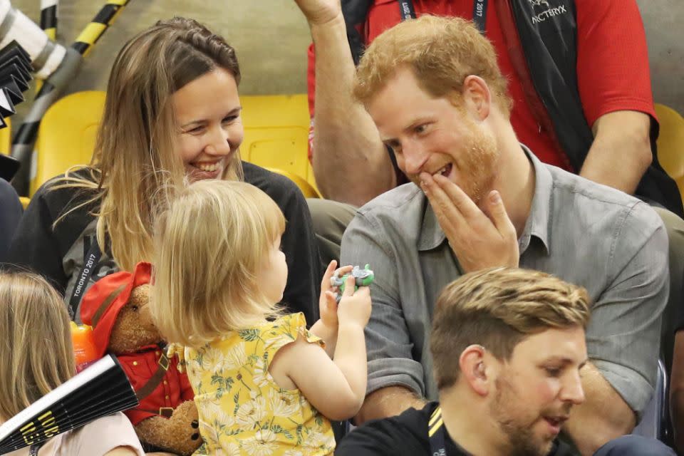 The moment a little girl stole popcorn from Prince Harry has been caught on camera. Photo: Getty Images