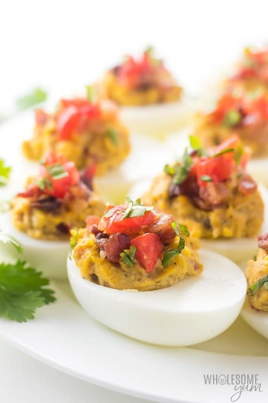<p>Wholesome Yum</p><p>These keto-deviled eggs with avocado and bacon are easy to make.</p><p><strong>Get the recipe: </strong><a href="https://www.wholesomeyum.com/mexican-keto-deviled-eggs-recipe-with-avocado-and-bacon/" rel="nofollow noopener" target="_blank" data-ylk="slk:Mexican Keto Deviled Eggs;elm:context_link;itc:0;sec:content-canvas" class="link rapid-noclick-resp"><strong>Mexican Keto Deviled Eggs</strong></a></p>