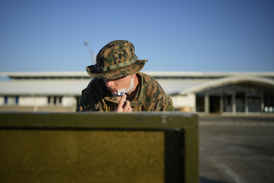 A U.S. soldier shaves before his day starts at Lal-lo airport, Cagayan province, northern Philippines Monday, May 6, 2024. The United States and the Philippines, which are longtime treaty allies, have identified the far-flung coastal town of Lal-lo in the northeastern tip of the Philippine mainland as one of nine mostly rural areas where rotating batches of American forces could encamp indefinitely and store their weapons and equipment within local military bases under the Enhanced Defense Cooperation Agreement, or EDCA. (AP Photo/Aaron Favila)