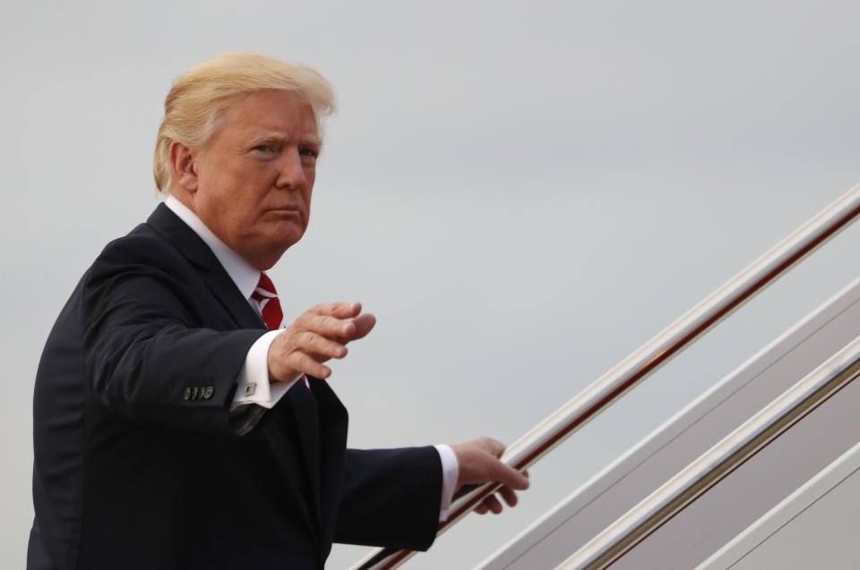 President Donald Trump waves as he boards Air Force One (AP Photo/Carolyn Kaster)