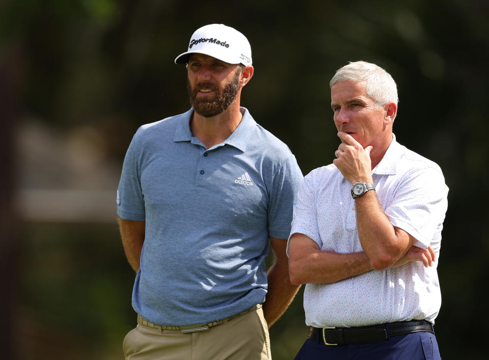 PGA Tour Commissioner Jay Monahan, pictured here speaking with Dustin Johnson in April.