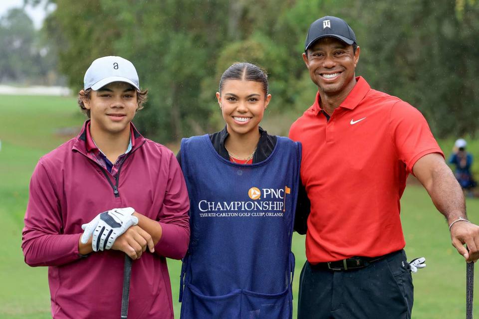 <p>David Cannon/Getty </p> Tiger Woods, Sam Woods and Charlie Woods in 2023