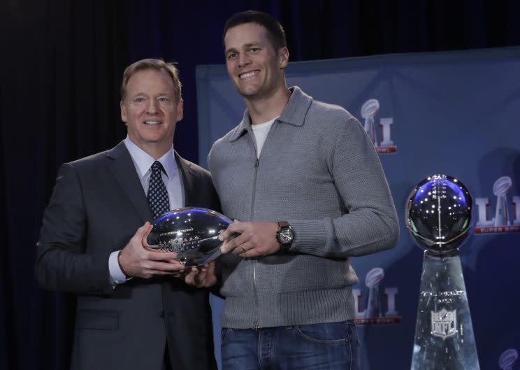 NFL Commissioner Roger Goodell, left, and New England Patriots quarterback Tom Brady pose with the MVP trophy during a news conference after the Super Bowl. (Photo: AP)