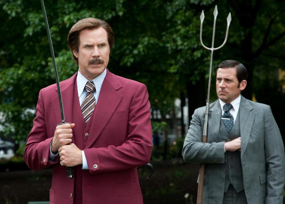 This image released by Paramount Pictures shows Will Ferrell as Ron Burgundy, left, and Steve Carell as Brick Tamland in a scene from "Anchorman 2: The Legend Continues." (AP Photo/Paramount Pictures, Gemma LaMana)