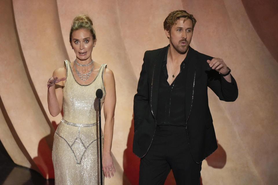 Emily Blunt, left, and Ryan Gosling speak during the Oscars on Sunday, March 10, 2024, at the Dolby Theatre in Los Angeles. (AP Photo/Chris Pizzello)