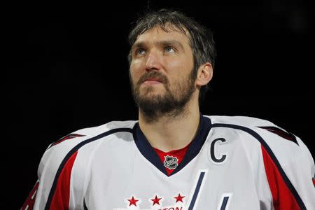 Feb 5, 2017; Washington, DC, USA; Washington Capitals left wing Alex Ovechkin (8) looks on during a ceremony honoring Ovechkin's 1,000th NHL career point prior to the Capitals' game against the Los Angeles Kings at Verizon Center. Mandatory Credit: Geoff Burke-USA TODAY Sports