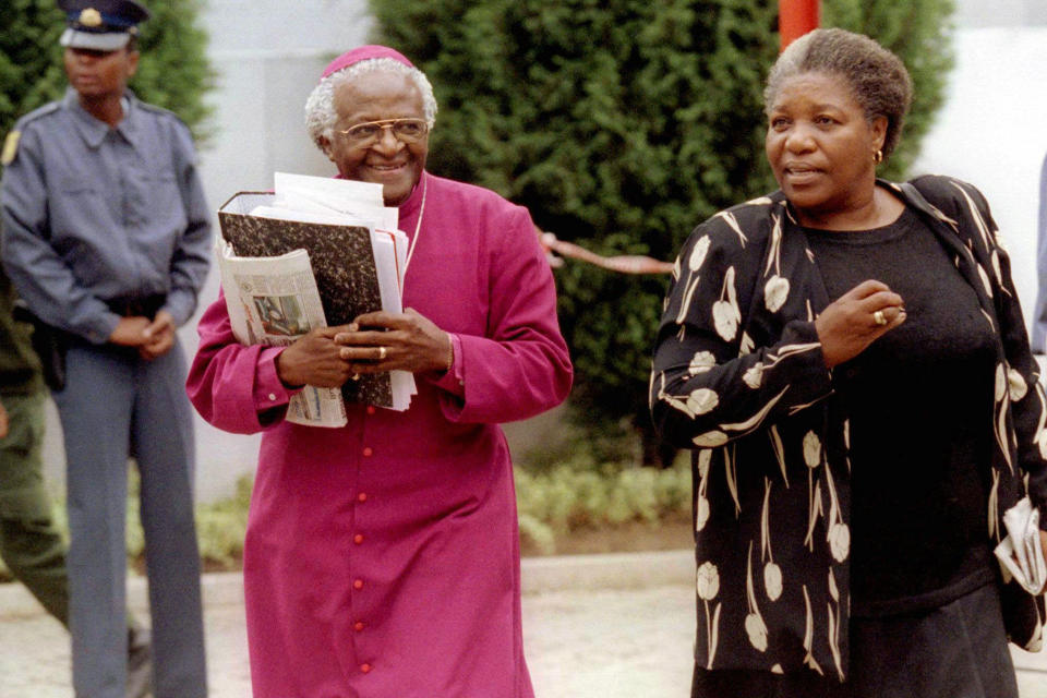 FILE - Desmond Tutu and his wife Leah arrive at the special public hearing of South Africa's Truth and Reconciliation Commission in Johannesburg, Nov. 27, 1997. Tutu chaired the commission, which solicited searing testimonials of violence from both victims and perpetrators as a way to heal the country after apartheid ended in 1994, holding out the possibility of amnesty for those who confessed to human rights violations and showed remorse. Yet Tutu acknowledged the commission left people on both sides of the conflict dissatisfied. (AP Photo/Pool, File)