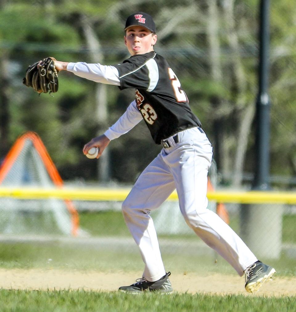Whitman-Hanson's Ryan Carroll throws out a runner during a game against Marshfield on Tuesday, May 10, 2022.