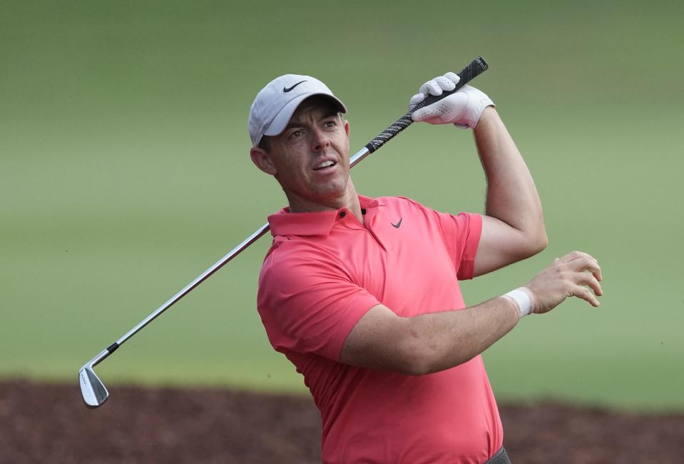 Rory McIlroy of Northern Ireland plays his second shot on the 18th hole during the round one of the DP World Tour Championship golf tournament, in Dubai, United Arab Emirates, Thursday, Nov. 16, 2023. (AP Photo/Kamran Jebreili)