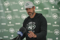 New York Jets quarterback Aaron Rodgers talks to reporters after a joint practice with the Tampa Bay Buccaneers at the Jets' training facility in Florham Park, N.J., Wednesday, Aug. 16, 2023. (AP Photo/Seth Wenig)