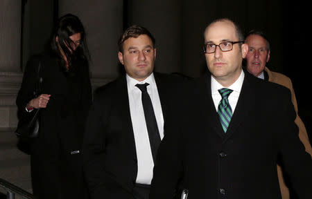 Former Cantor Fitzgerald trader David Demos (L) exits the federal courthouse with his attorney Daniel E. Wenner in New Haven, Connecticut, U.S., December 9, 2016. REUTERS/Michelle McLoughlin