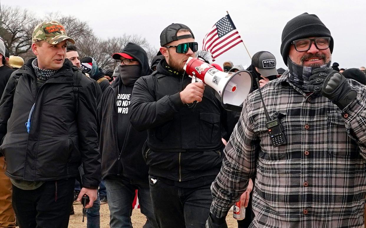 Proud Boys members Zachary Rehl, left, Ethan Nordean, centre, and Joseph Biggs stormed the US Capitol on January 6 2021